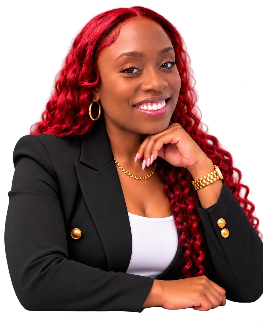Melicia smiling, wearing a black blazer and gold jewelry
